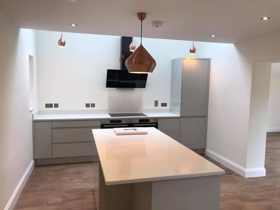 Grey Shaker kitchen at the Inkberrow new-build with white stone worktops