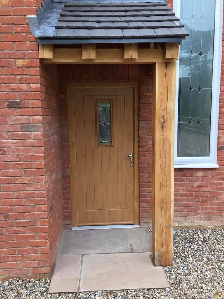 Oak-framed porch entrance with composite front door on the Inkberrow four-bedroom new-build by JRC Developers