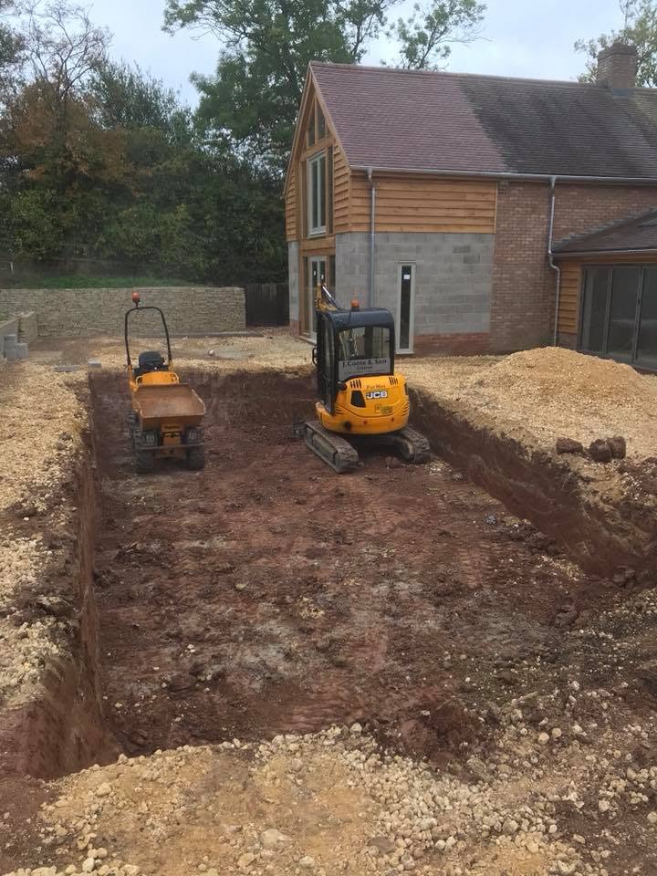 Deep extension footings excavated beside the existing house with a mini digger and dumper on site