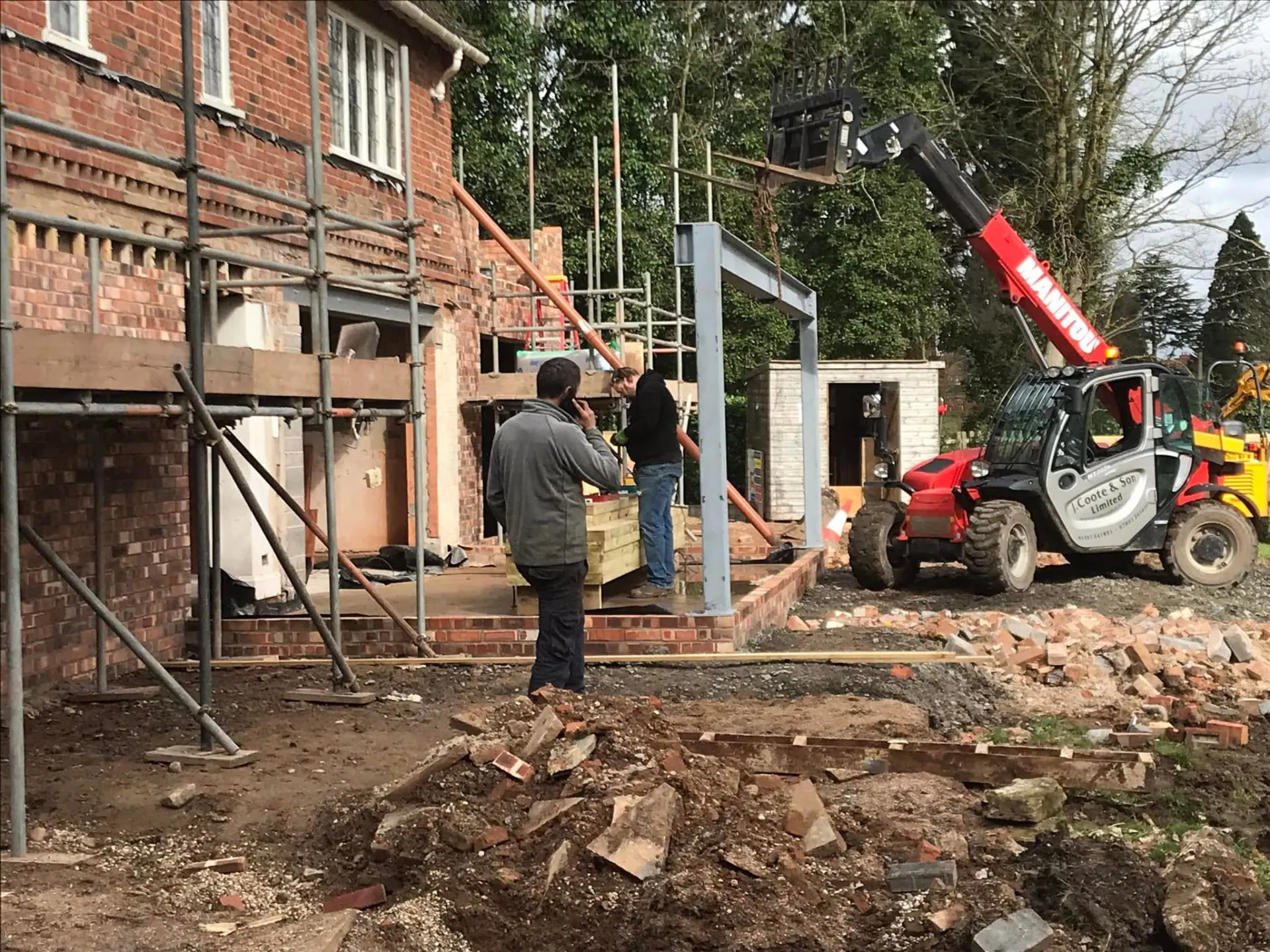 JRC Developers lifting structural steel into place at the rear of the house during the remodelling works