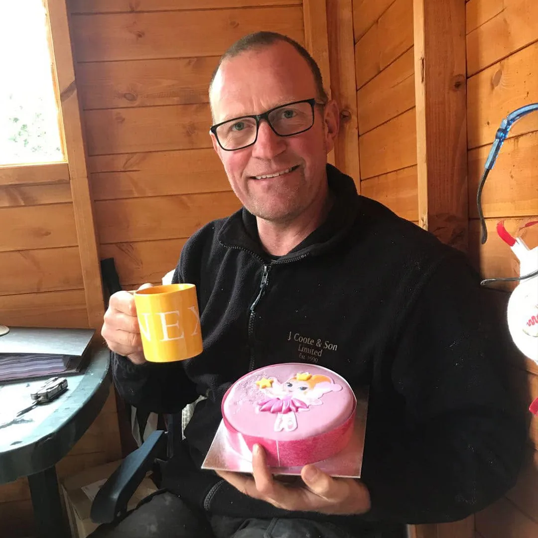 John taking a tea break on site in his J Coote & Son fleece