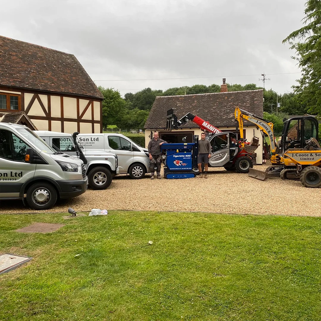 John and Jack with the JRC Developers fleet of vans, mini-crusher, digger and dumper at the Worcestershire yard