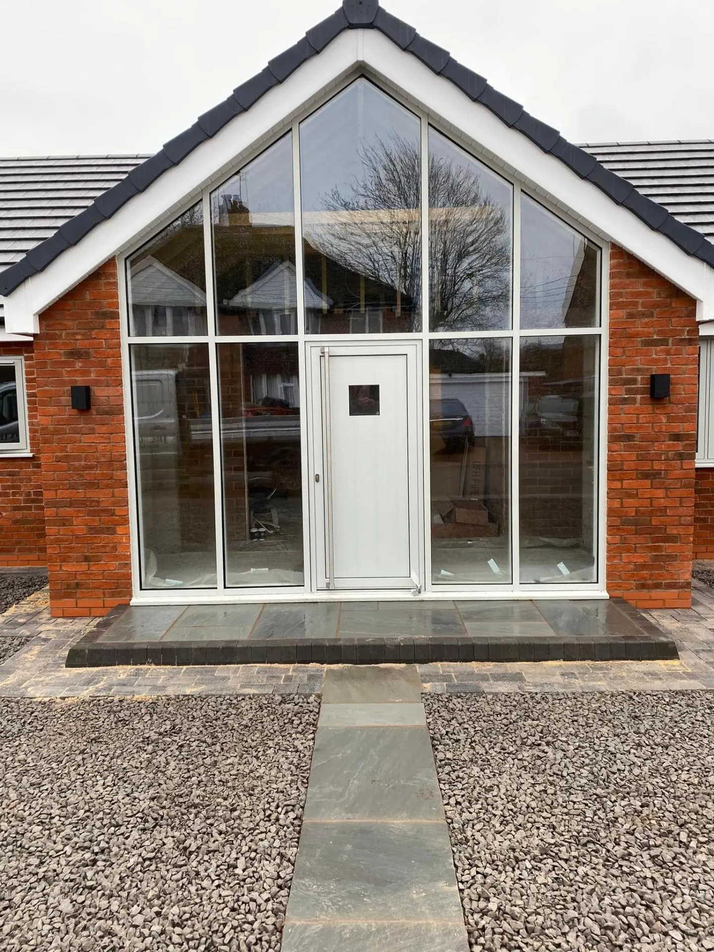 Close-up of the completed glazed gable entrance at White Gates