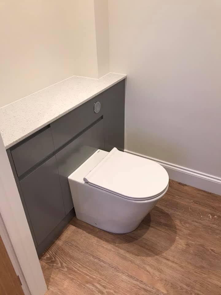 Downstairs WC with grey vanity and quartz worktop at the Inkberrow new-build