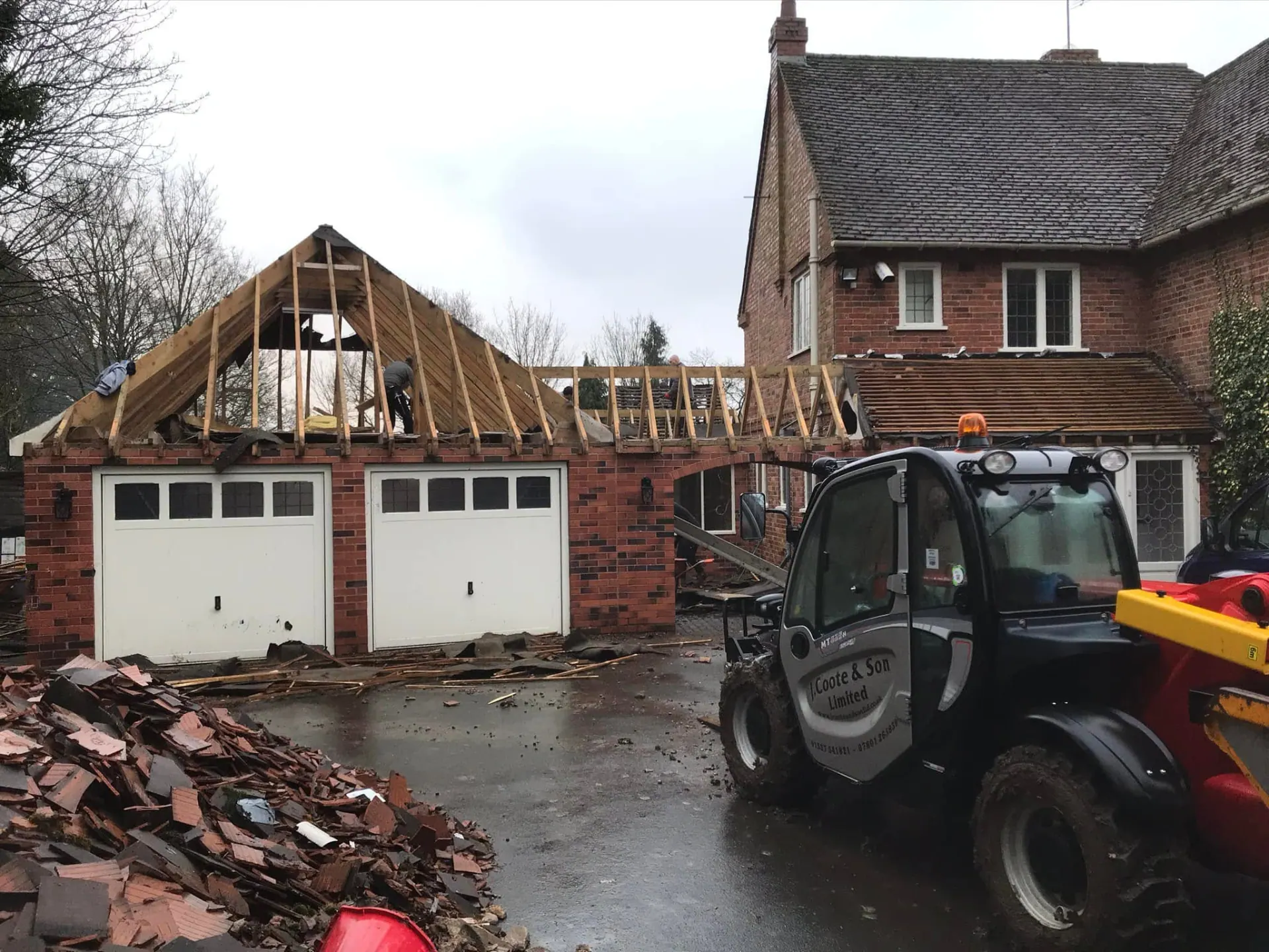 Older garage and covered link stripped back to roof structure during the rebuilding works at the front of the property